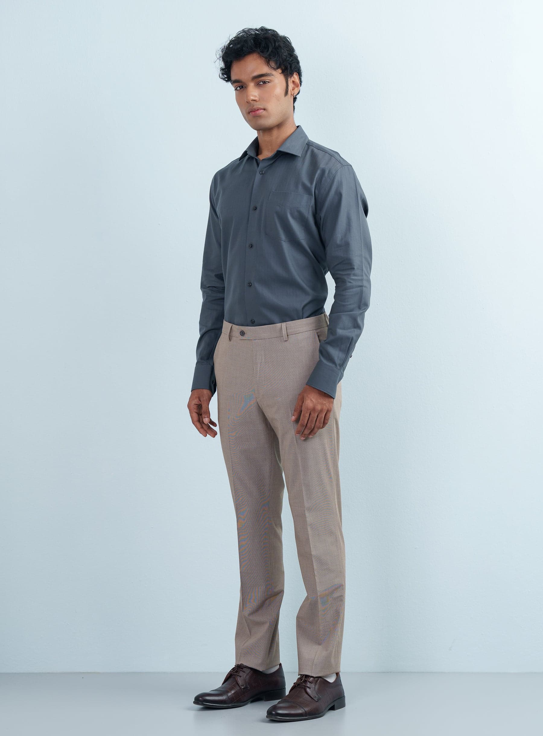 Front view of a man wearing a slim fit Charcoal Grey Herringbone Texture Formal Shirt.