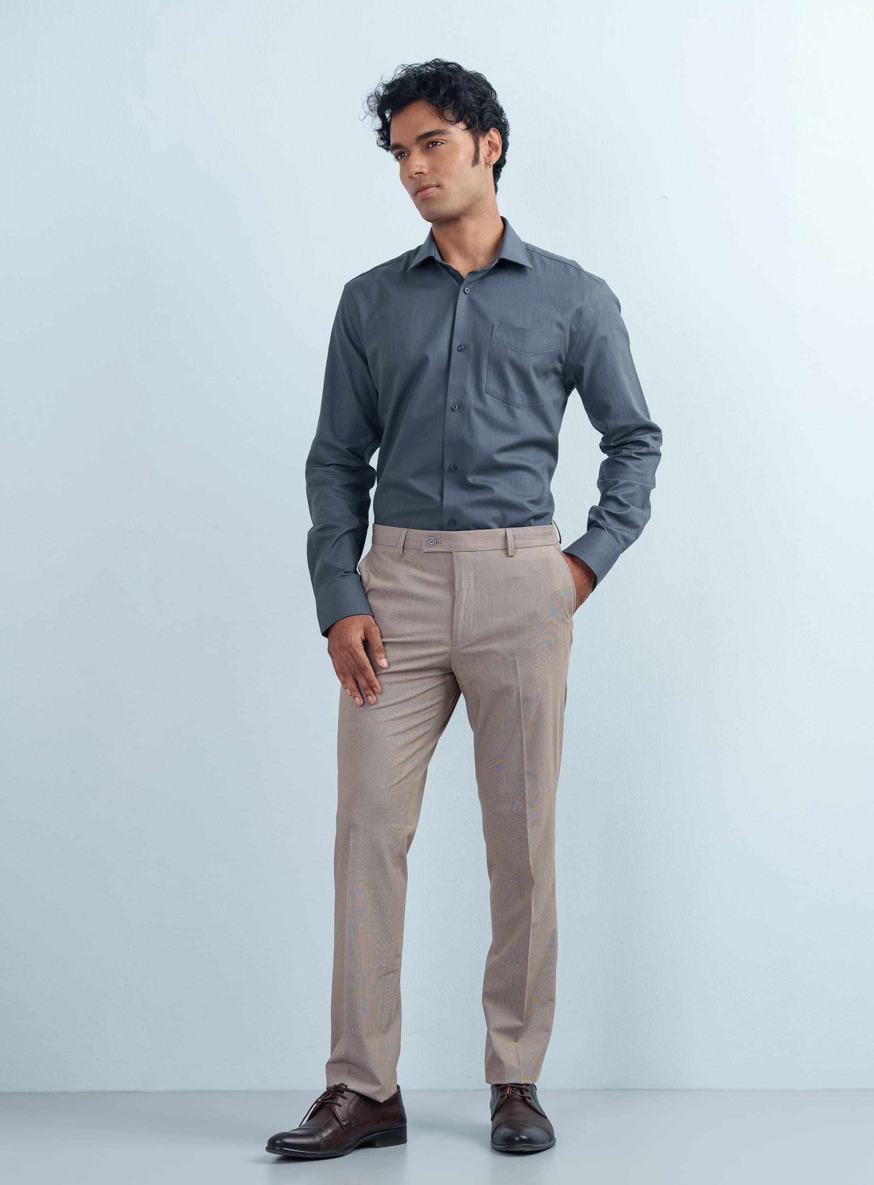 Front view of a man styling a Khaki Beige Micro-Check Texture Formal Pant with a dark dress shirt.